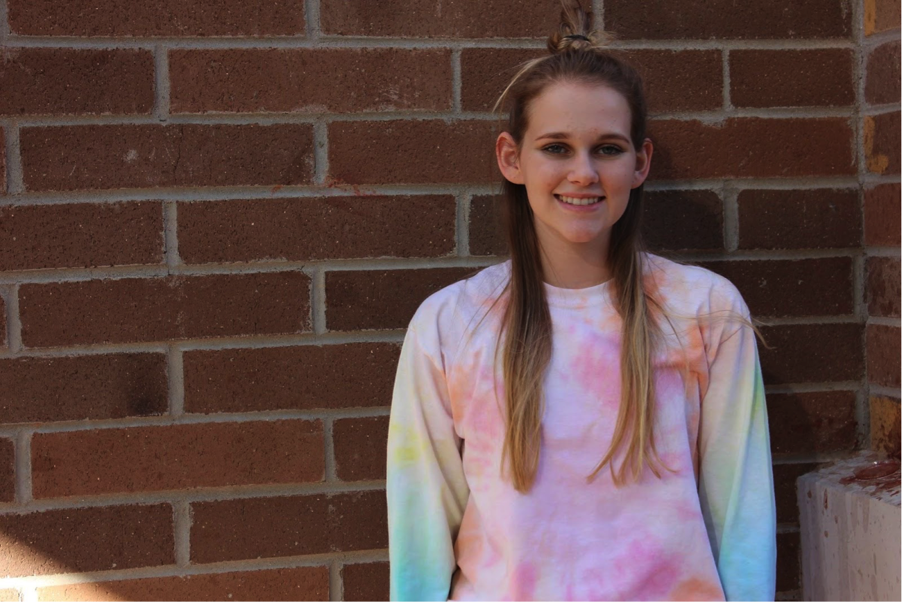 Senior Nicole Long stands outside Verrado High School’s cafeteria. Long was nominated for the nationwide Outstanding CTE Student award which includes a scholarship and a trip to Washington D.C. to meet the president where she will discuss all of her accomplishments in Verrado’s CTE broadcast and graphic design programs. Photo credit to Krysyan Edler.