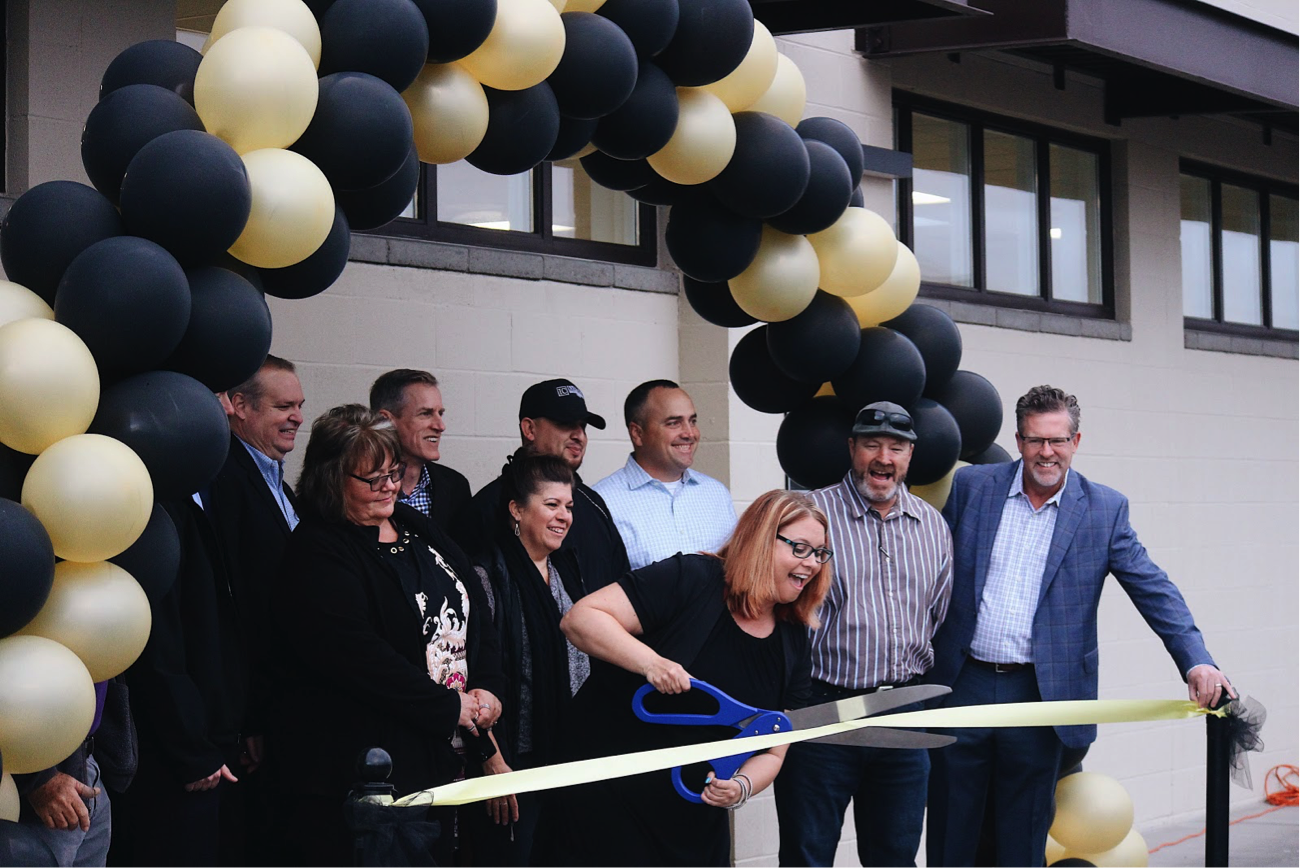 Principal Kristen Tiffany cuts the ribbon at the Field House opening on Wednesday January 10, 2018 to celebrate the inauguration of this everlasting structure. Students and faculty look forward to the benefits that come from this new training facility, such as spacious locker rooms and extra classrooms. Photo credit to Kayla Wilson.