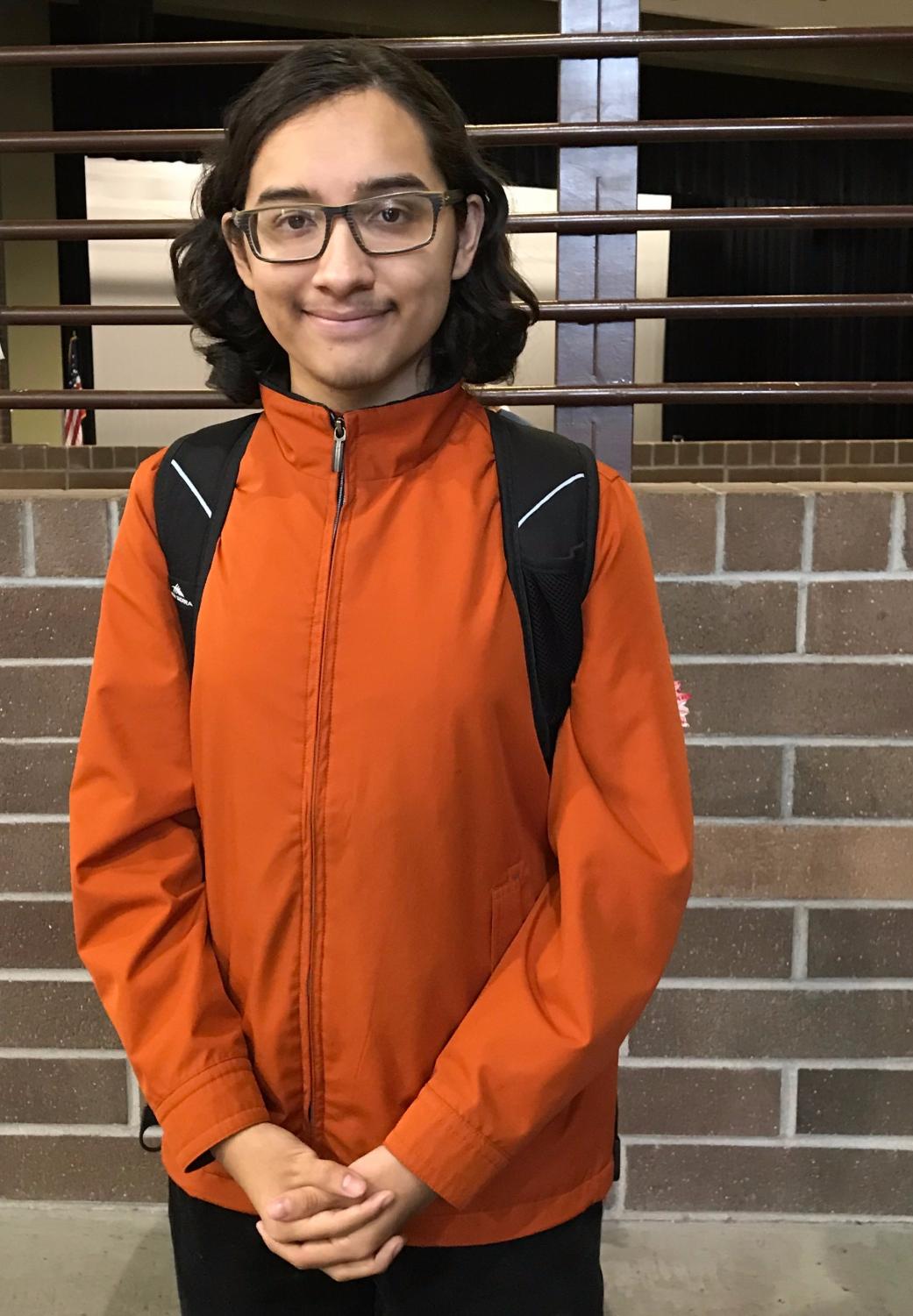 Junior Dylan Katz poses for a picture. Katz appointed himself as Verrado’s door holder and has made it his job to hold the door for students entering and exiting the school, most notably for everyone leaving the Verrado Fashion Show. Photo credit to Krysyan Edler.