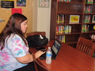 Sophomore Marisa Tapia working on academics in the Verrado High School library. 