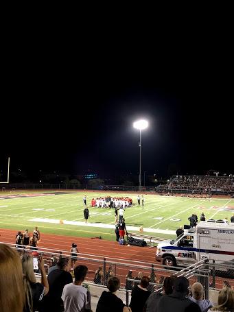 Sep. 5: Verrado and Williams Field football players take a knee in the center of the field after a player injury