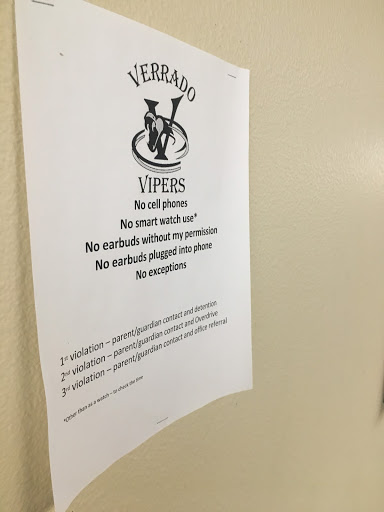 Posters around Verrado High, like the one above, inform students about the schools new OverDrive policy.