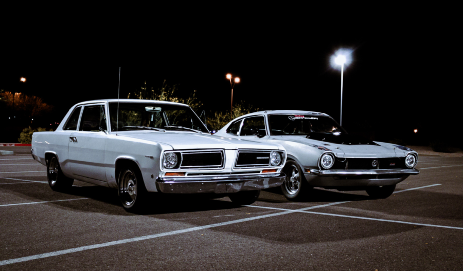 Two classic cars meet up in a parking lot in Verrado. 