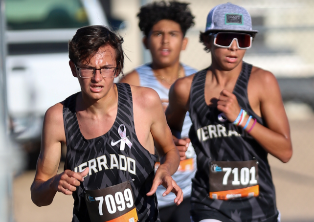 The boys cross country team power through a tough part of their race. 