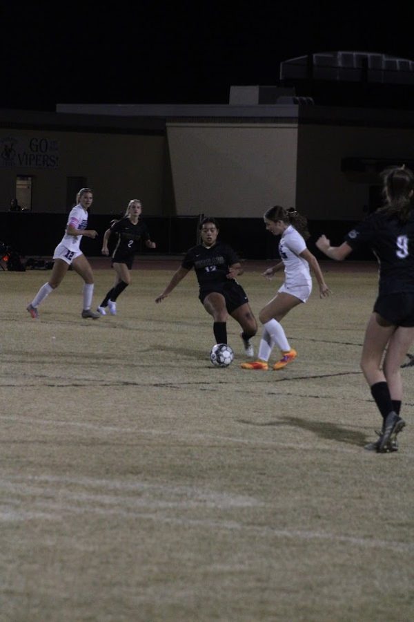 At a recent soccer game between Verrado and Sunrise Mtn. varsity girls control the ball. 