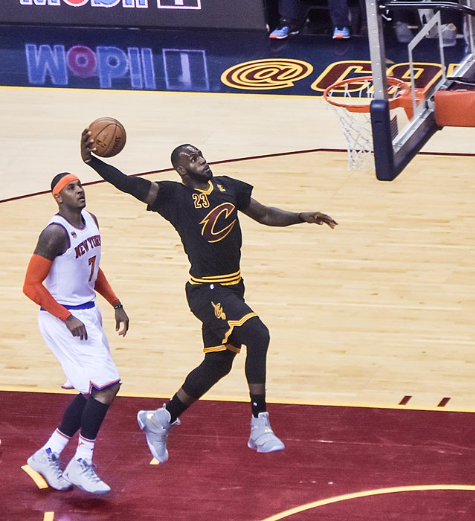 LeBron James throwing down a dunk after blowing by Carmelo Anthony