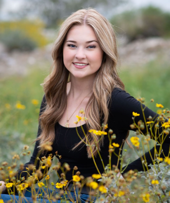 Delaney poses in a field of flowers for one of her senior pictures. 