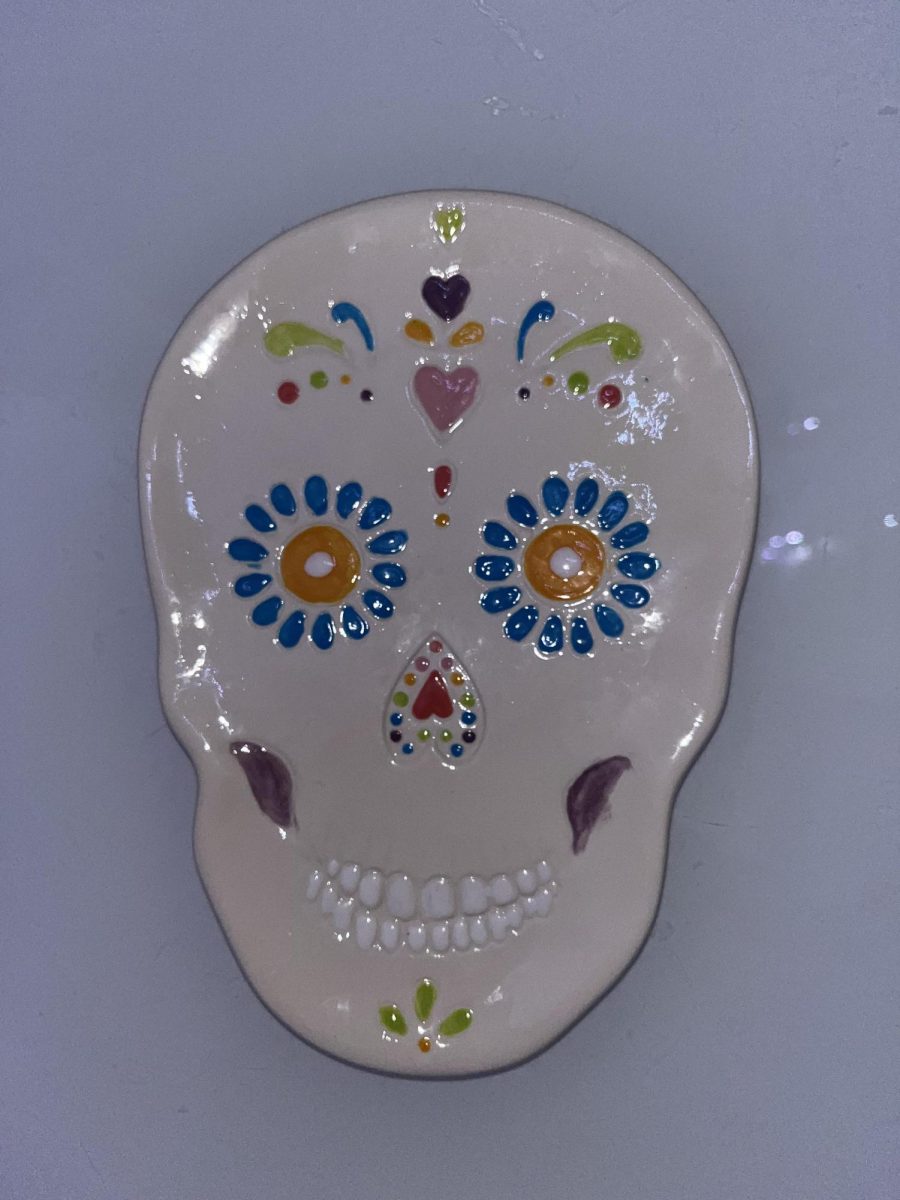 A Sugar Skull ceramic piece that you can paint at As You Wish pottery in Westgate. 