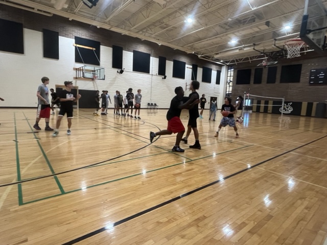 Viper Boys basketball team practicing for the season during tryouts in the gym.
