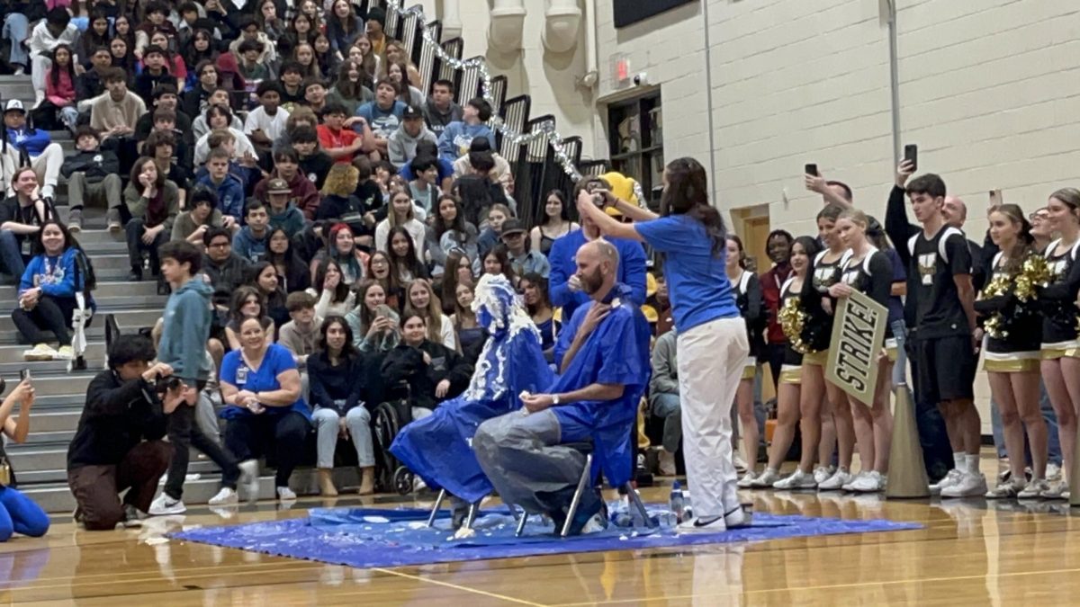Principal Thomas and Assistant Principal Bonessi became human sundaes with ice cream, chocolate sauce and whipped cream dumped on their heads. 