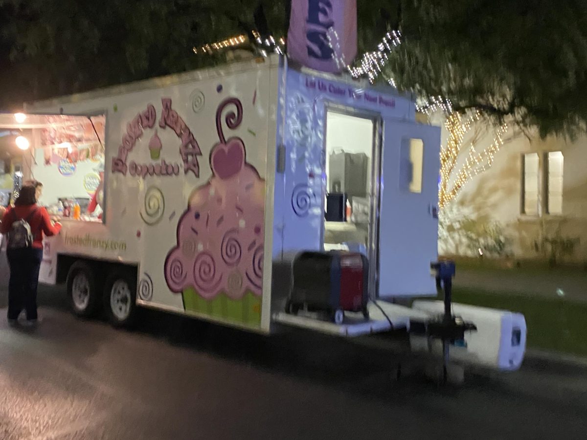 A cupcake truck that had many types of flavors to choose from.