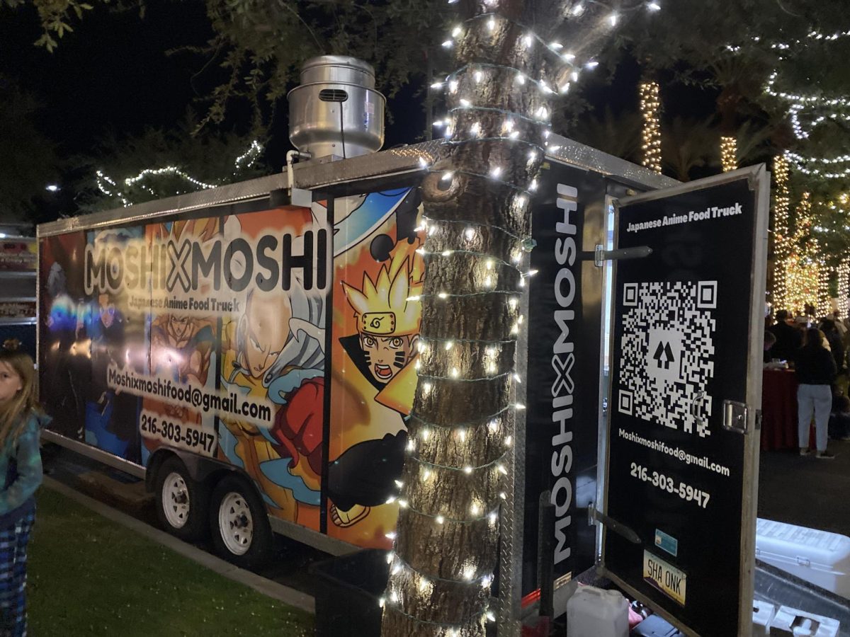 An Anime themed food truck with a bunch of treats at the Christmas Lighting!