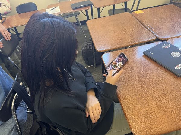 Student at Verrado Highschool scrolling on Tik Tok during class instruction
