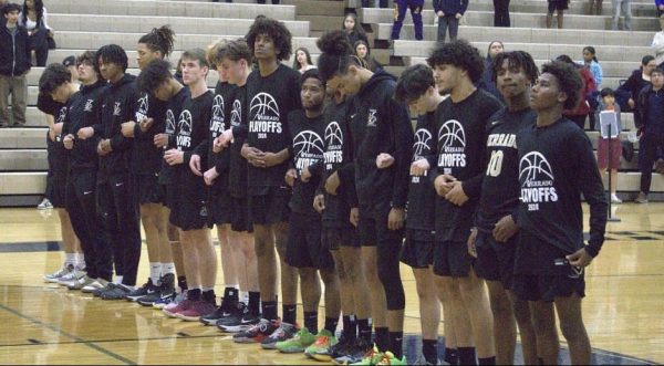 Verrado basketball stands for the Pledge of Allegiance, mentally preparing for their upcoming playoff game in which they are about to face Apollo High School