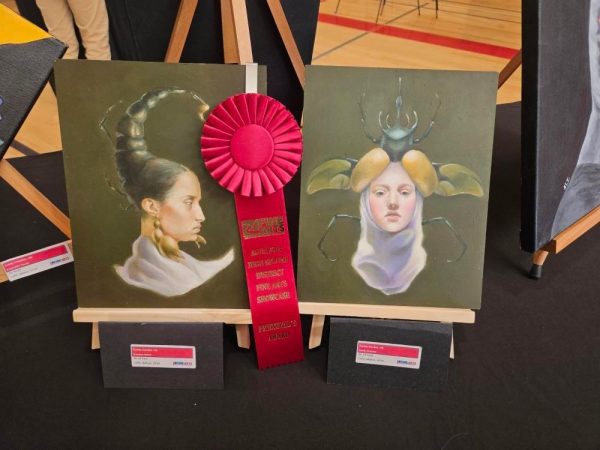 Two matching paintings depicting women with insect hairstyles were displayed at the event and won an award.
