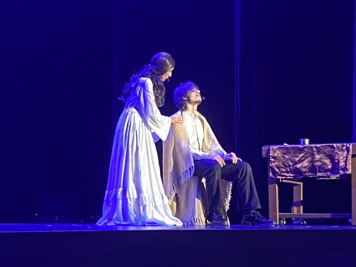 The end of the musical shows the ghost of Fantine (Gab Chavez) comforting Jean Valjean (Micheal Myers) before he passes away.