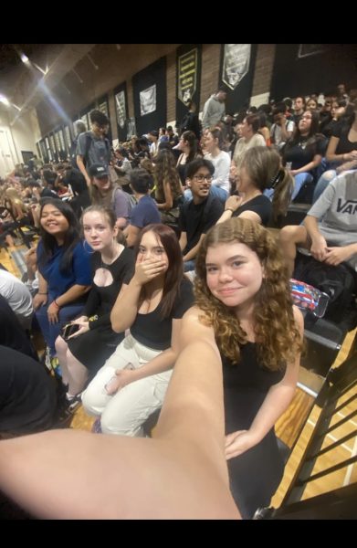 Emma McWhorter and her friends taking a quick selfie at an assembly.