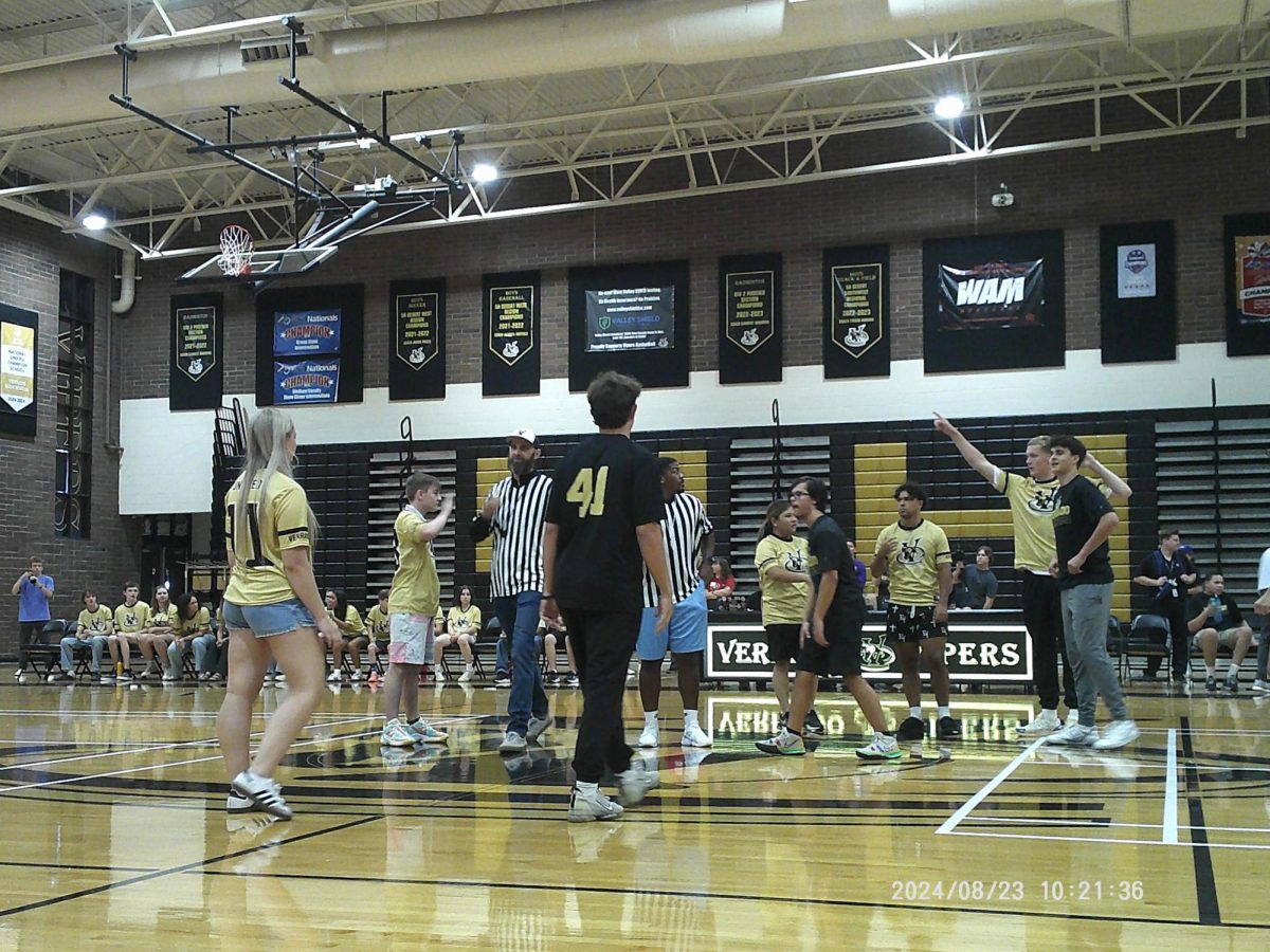 The Verrado Unified Basketball team assembles on the court to begin the annual gold and black game. 