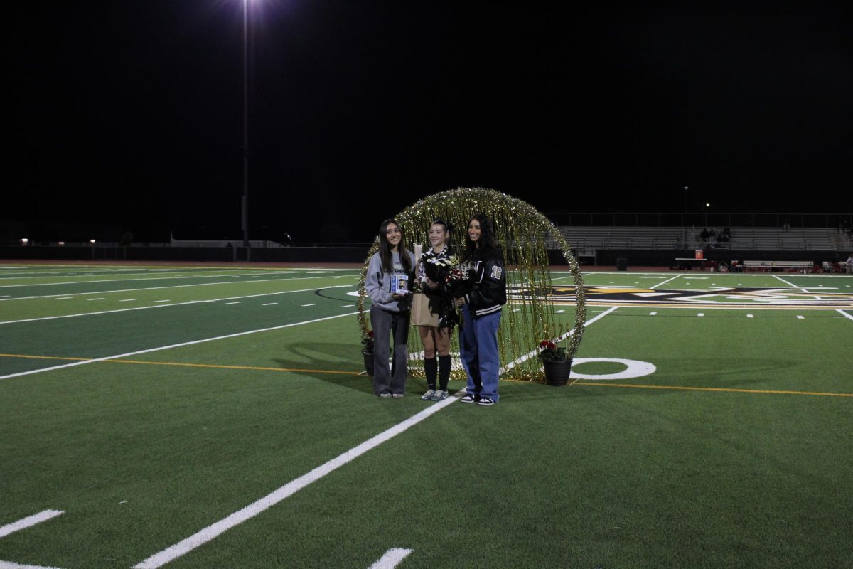 Family pose during Senior Night for Girls Soccer before the game at Verrado. 