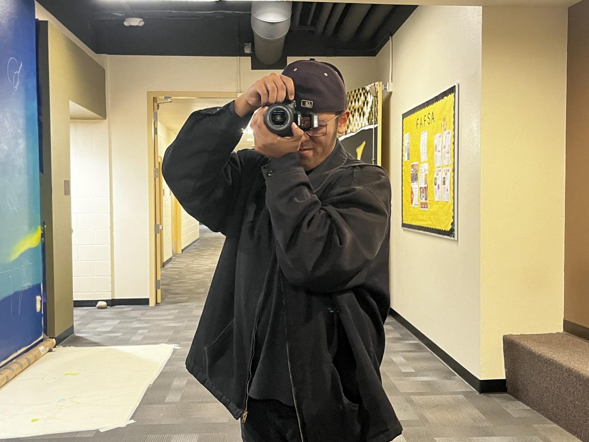 Digi-Com student Jacob Ceron with his camera, ready to photograph around campus. 