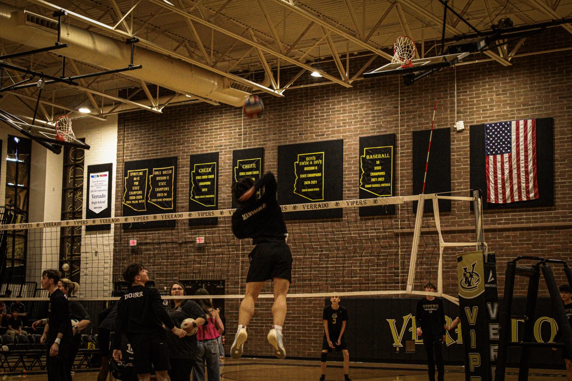 #9 Jason Mamaradlo warming up before the game.