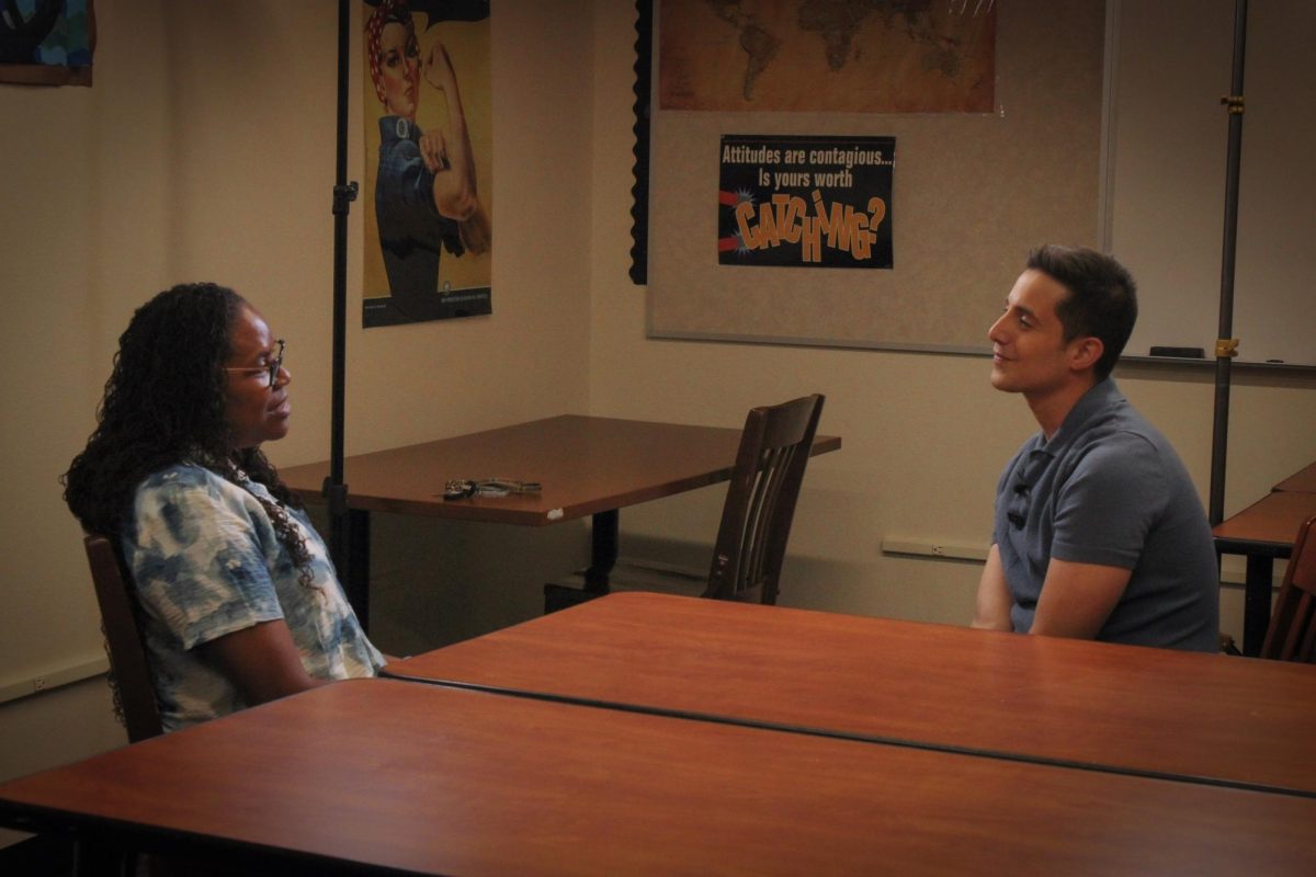 Photo of Nick Ciletti talking with Mrs. Jackson.