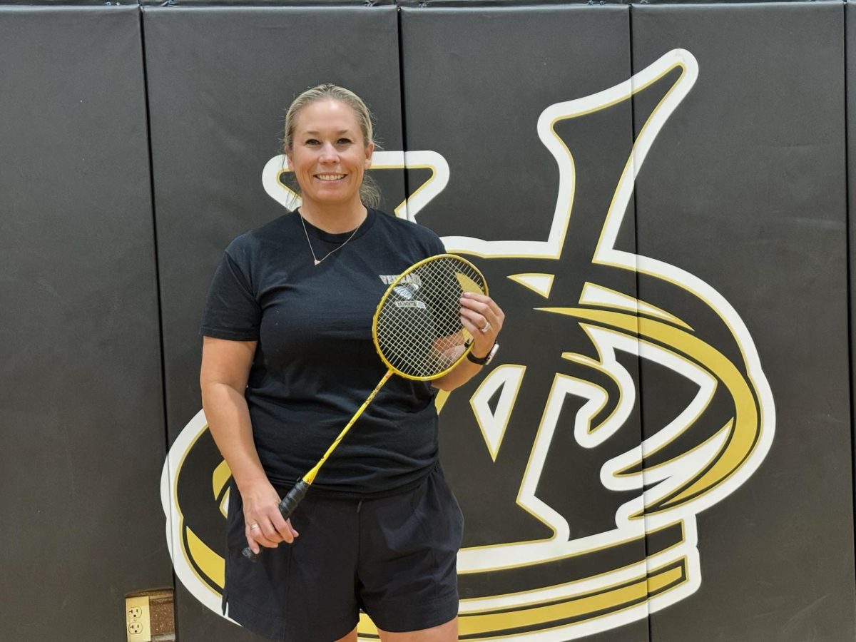 Ms. Wadding gets ready for the season by running drills with some of the girls on the Badminton team. 