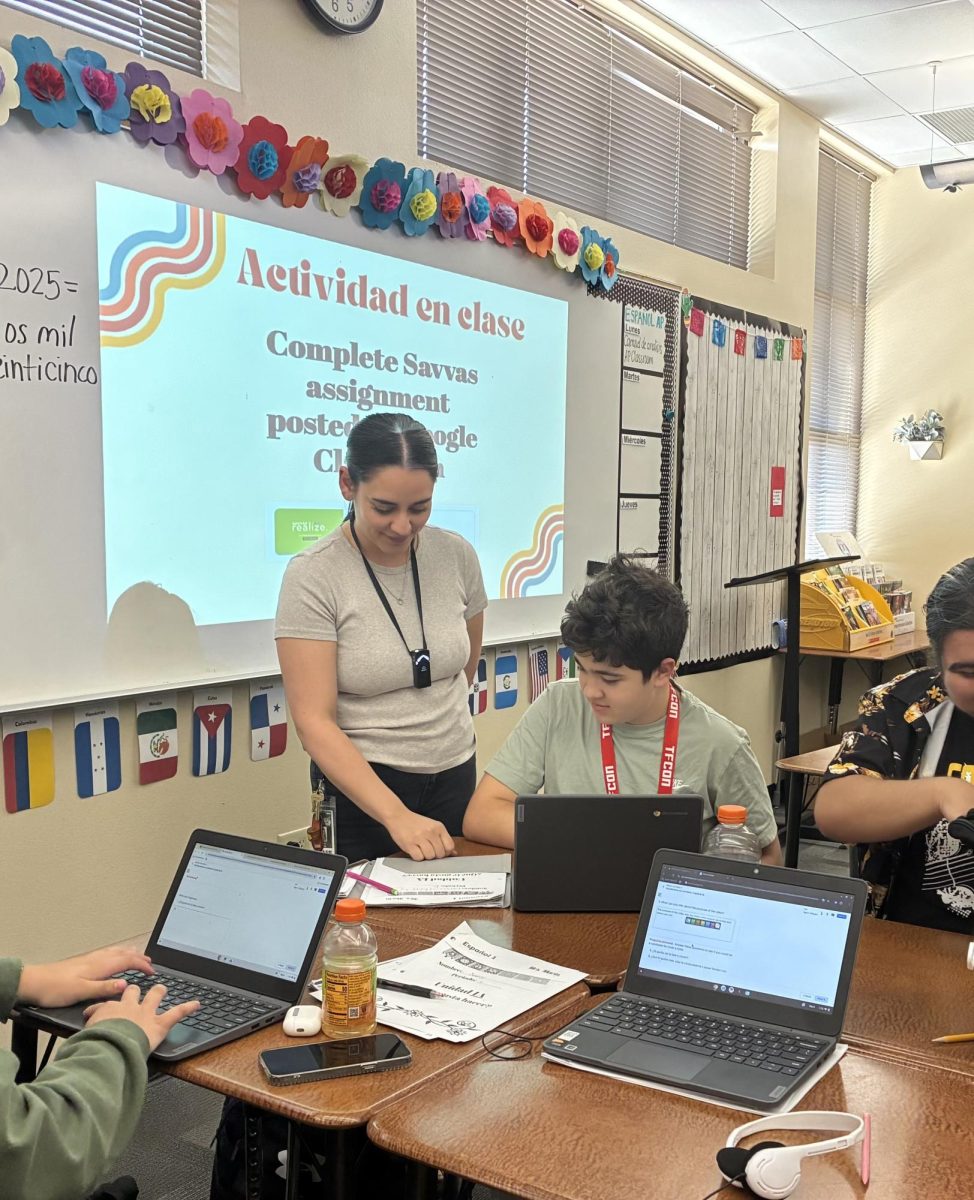 Ms. Marin helping out her students.