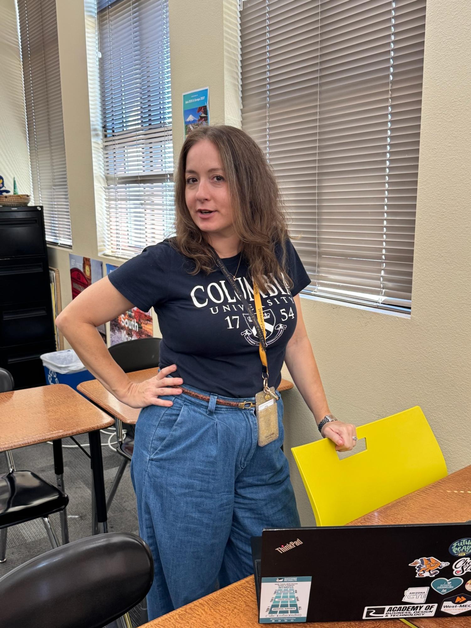 Mrs. Palmgren, Pom Coach and Counselor at Verrado High School, strikes a pose. 