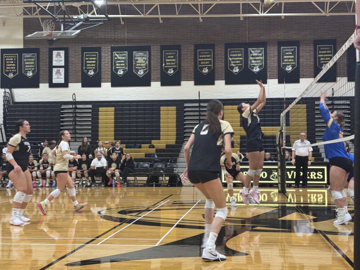 Varsity volleyball girls in action versus Buckeye.