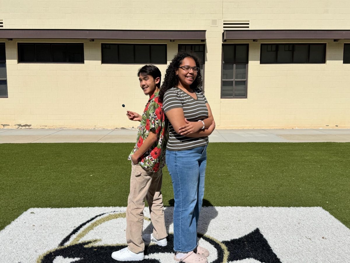 Verrado's award winning podcast team, Antonio Larson and Magnolia Amadeus, pose outside the courtyard.