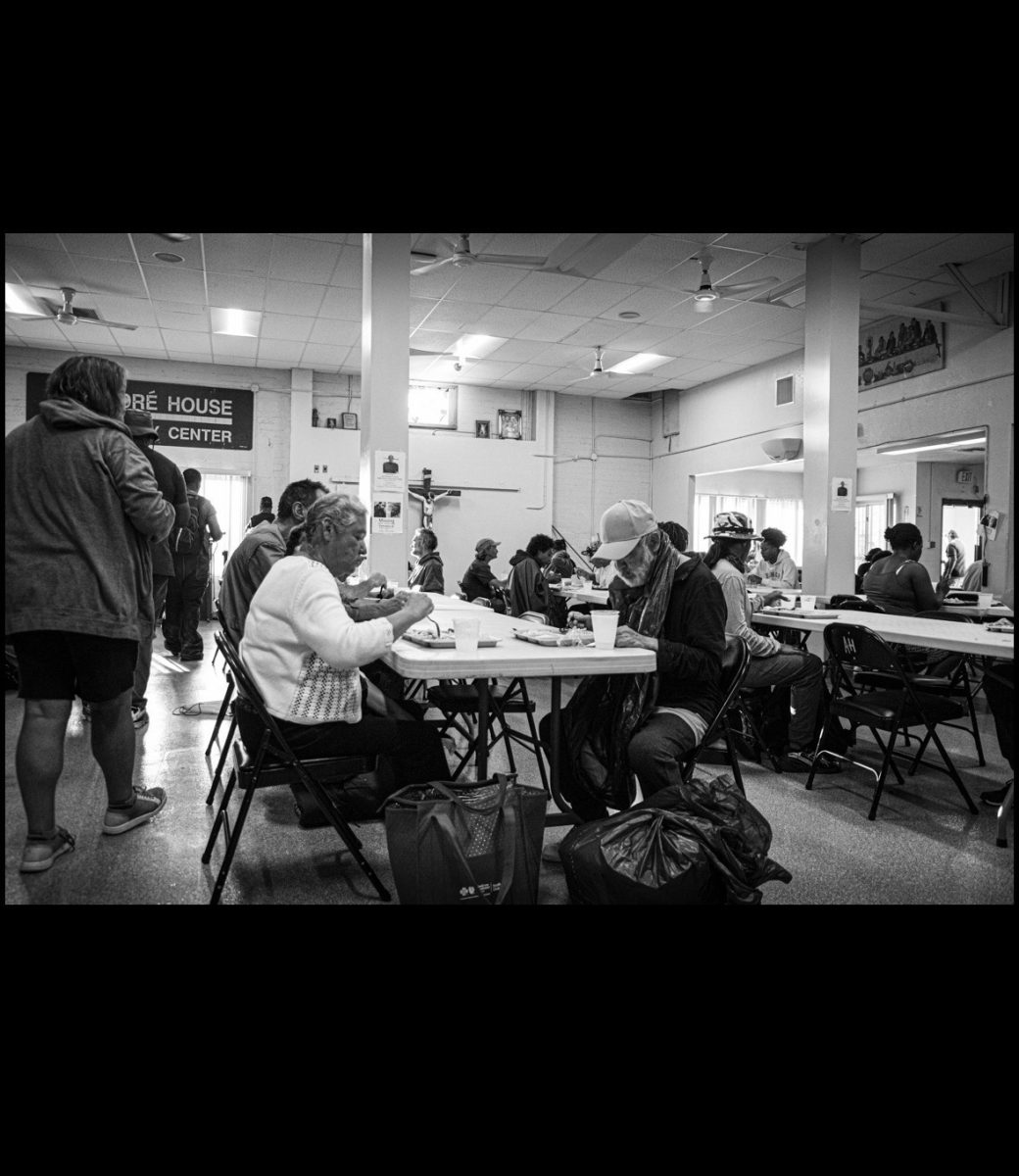 Guests at the Andre House eating a meal served by members of the Kennet Club. Photo courtesy of Jazmine Gomez.