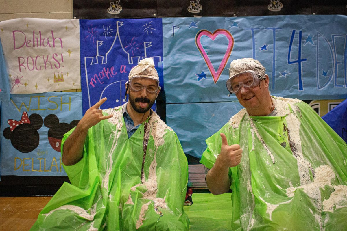 The aftermath of Mr. Avila and Mr. Cromer being poured dessert items on.
