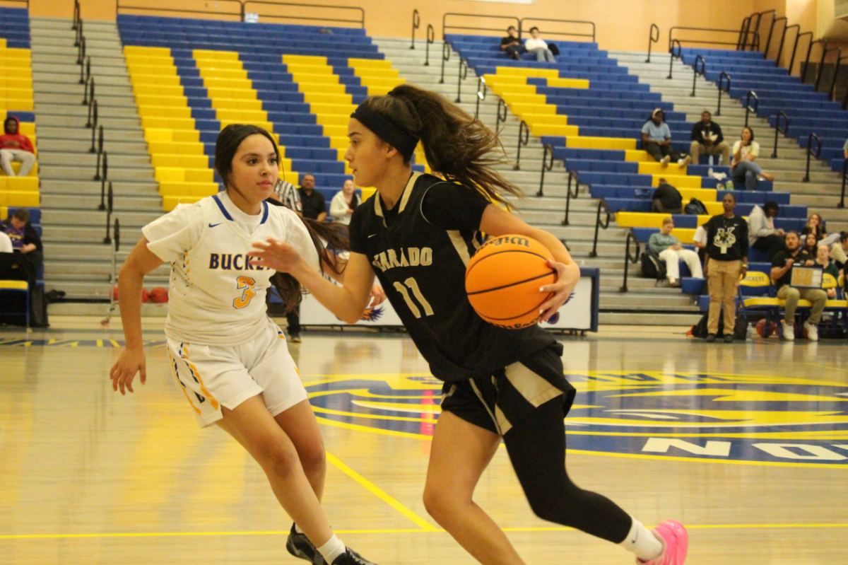 Verrado girl's basketball Tillie Smith practicing against Buckeye before the game starts.
