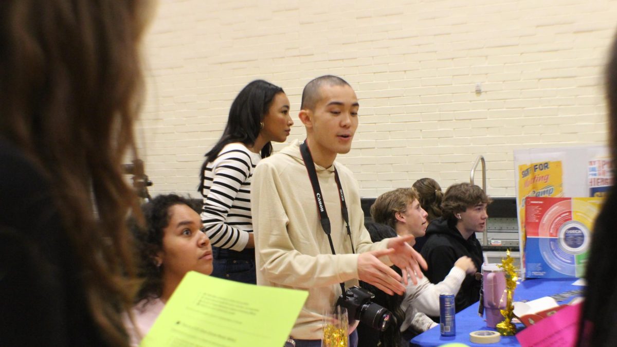 Photo of Viper Times Podcaster and Artist, Antonio Larson explaining what we offer here at the Viper Times.