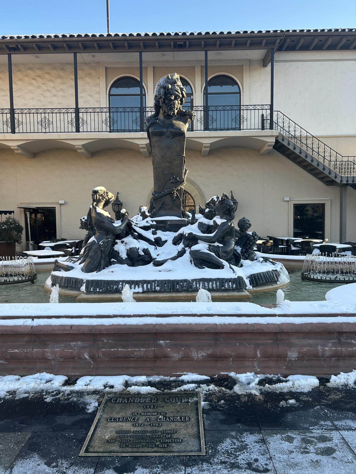 Fountain covered in snow. infront of a Cheesecake Factory in Kansas City