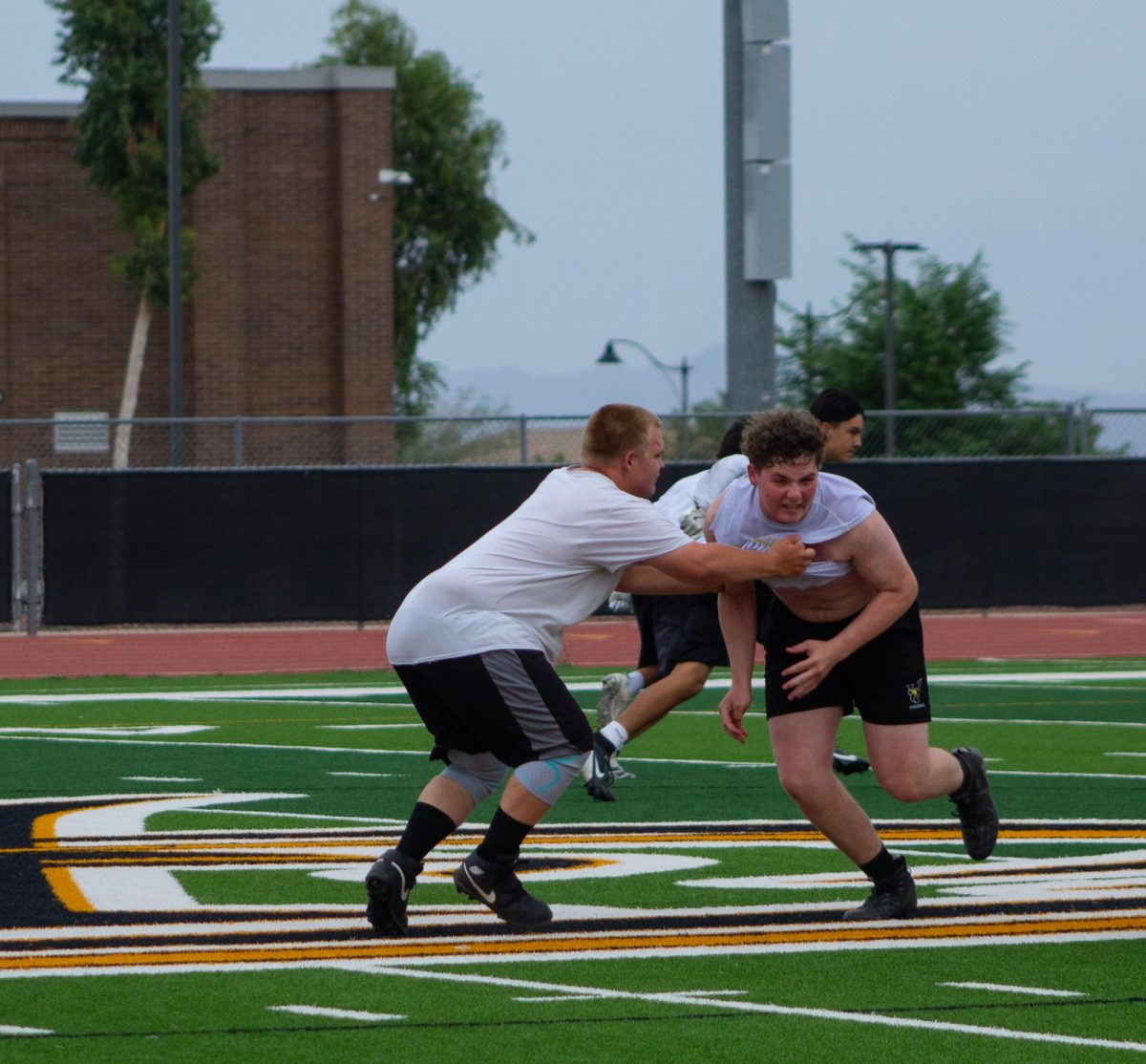 Two players for the Verrado Vipers while doing drills at their practice.