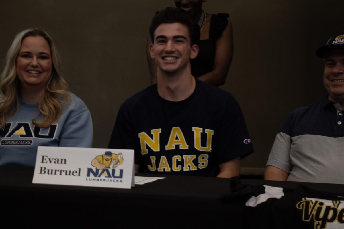 Evan Burruel signing to Northern Arizona University for Boys Cheer.